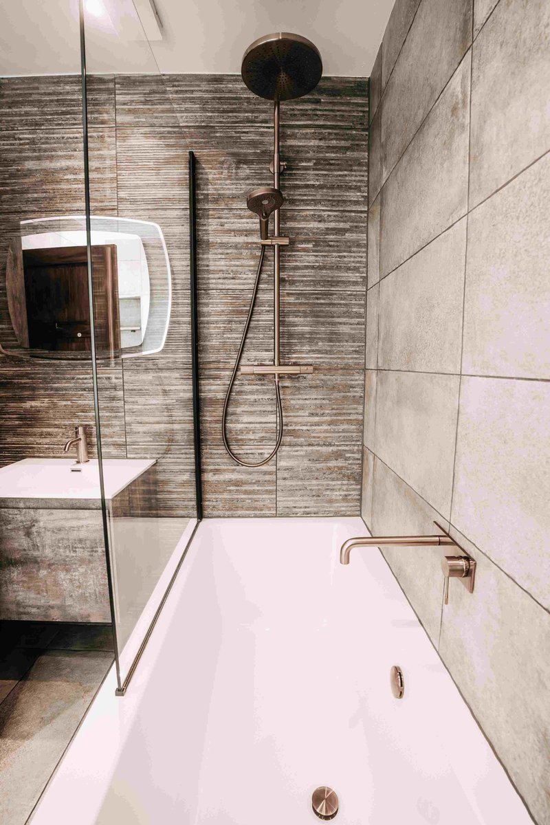 Bath-shower zone overhead with bronze rainfall